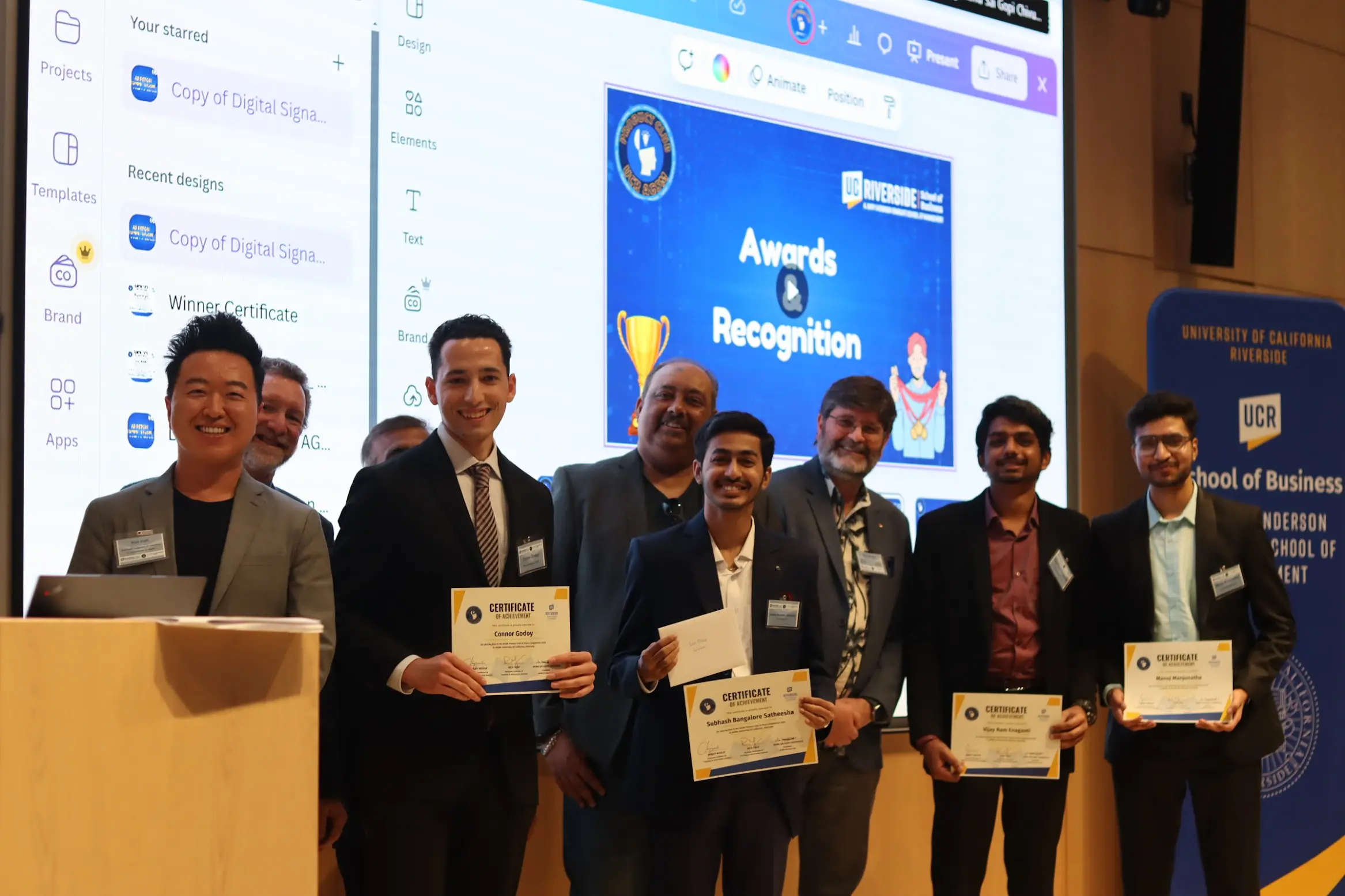 A group of people holding certificates
