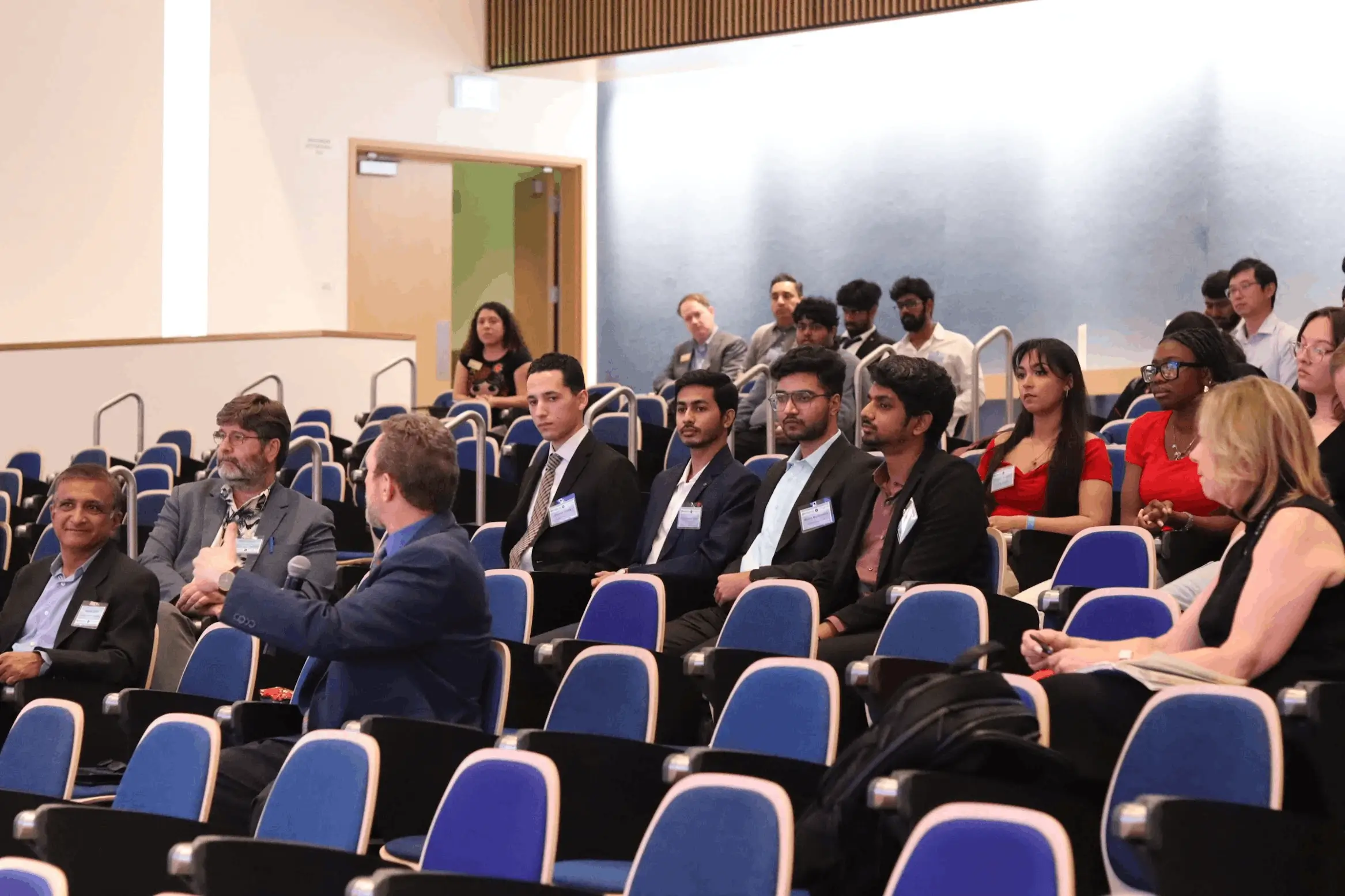 Students and faculty members in a meeting